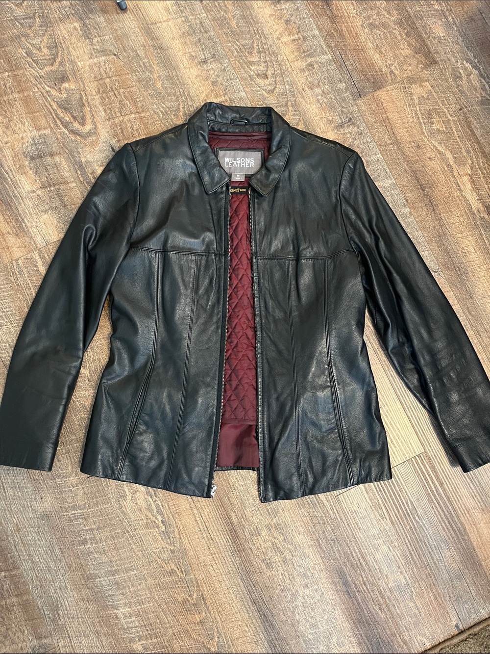 Wilsons Leather Black Leather Jacket with Quilted Burgundy Lining